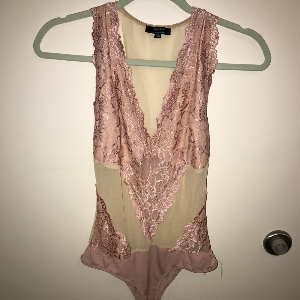 Pink and nude body suit